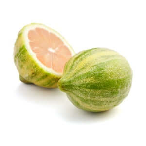 Variegated Pink Lemon fruit cut in half showing its pink interior against a white background.