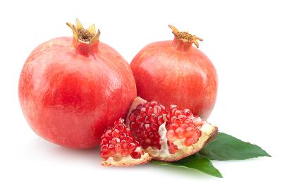 sweet pomegranates on a white surface